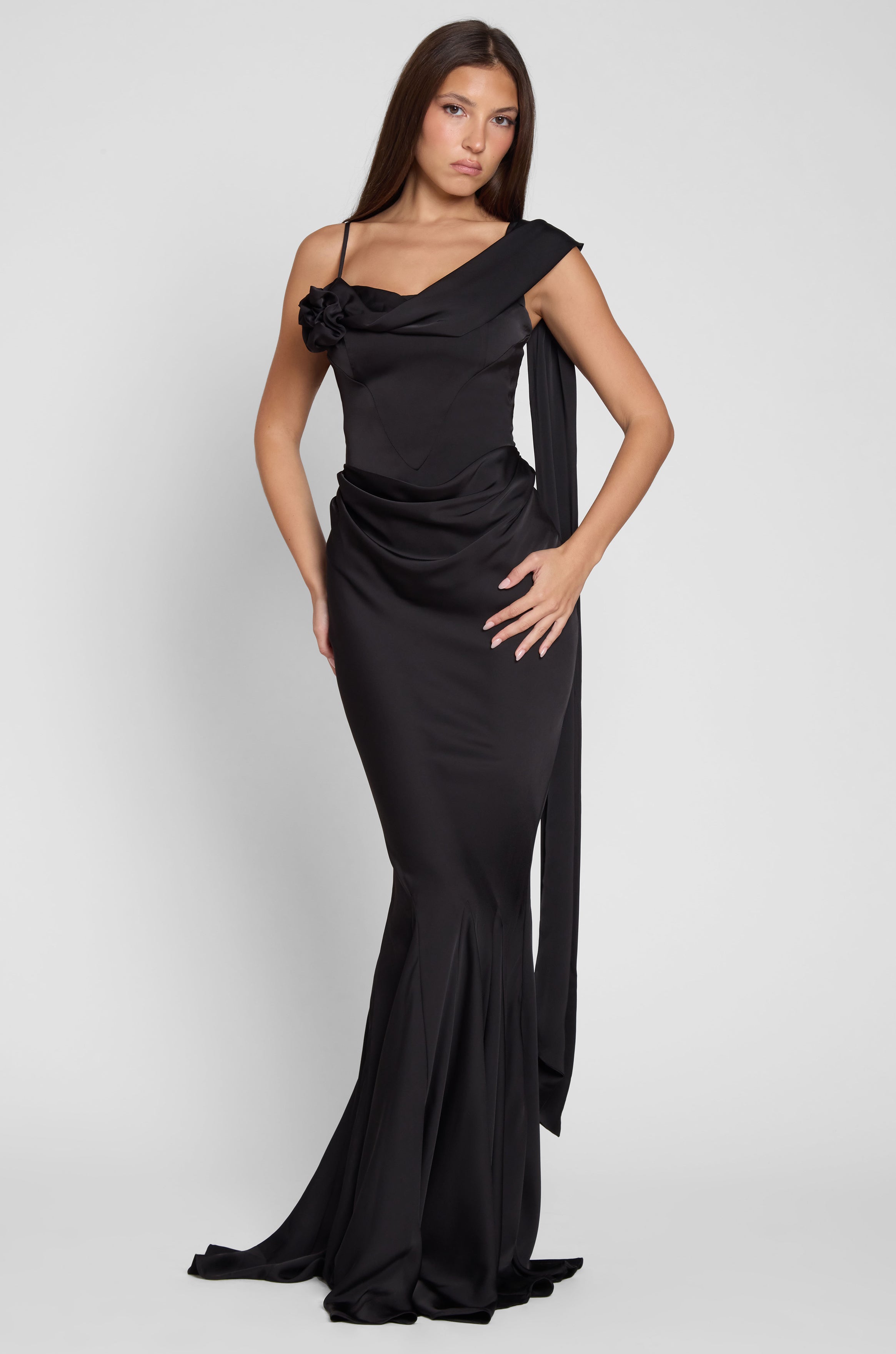 Model is wearing Celine Corset Drape Satin Gown in Black, front view.