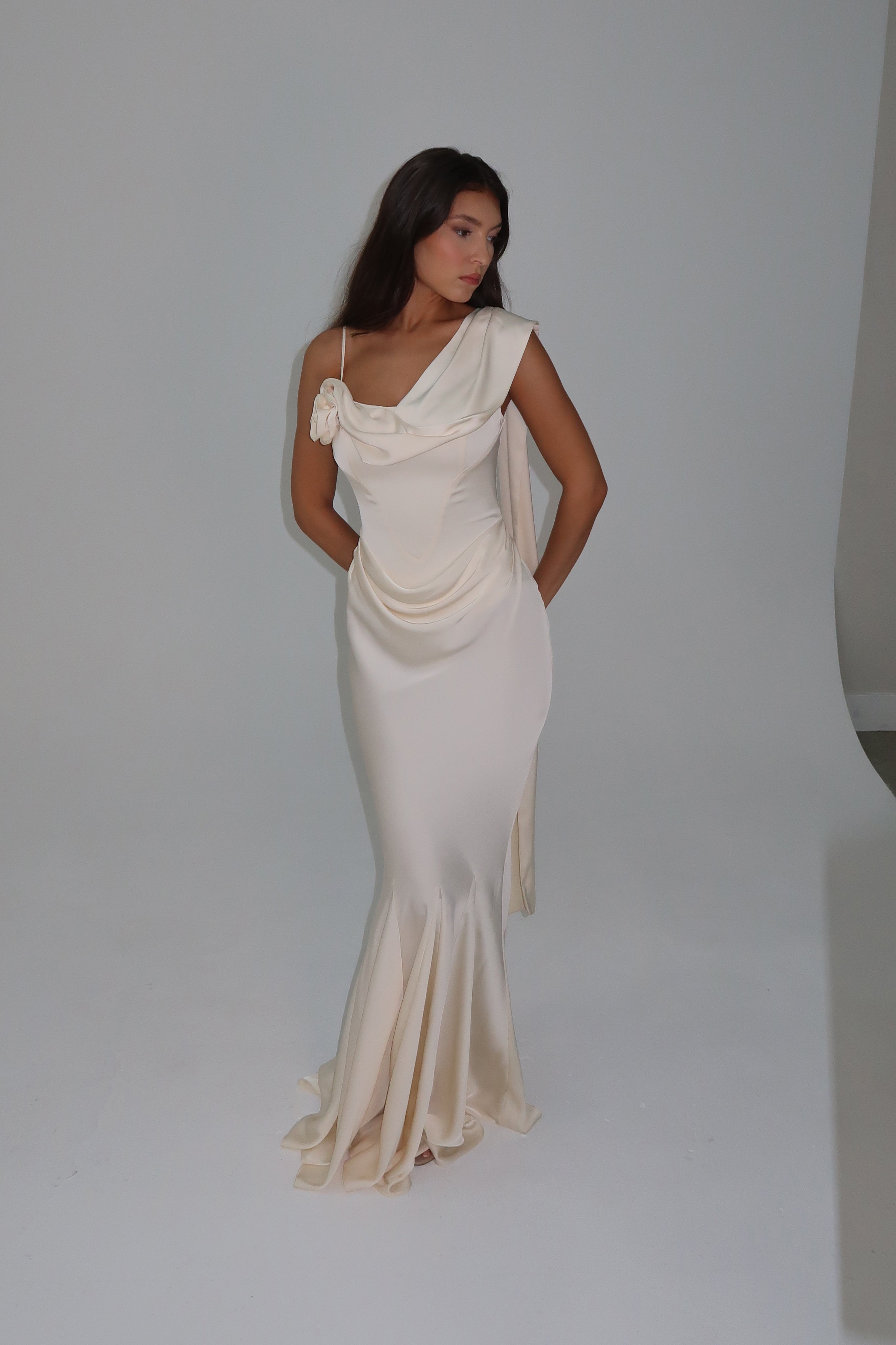 Model wearing Celine Corset Drape Satin Gown in Ivory, front view.