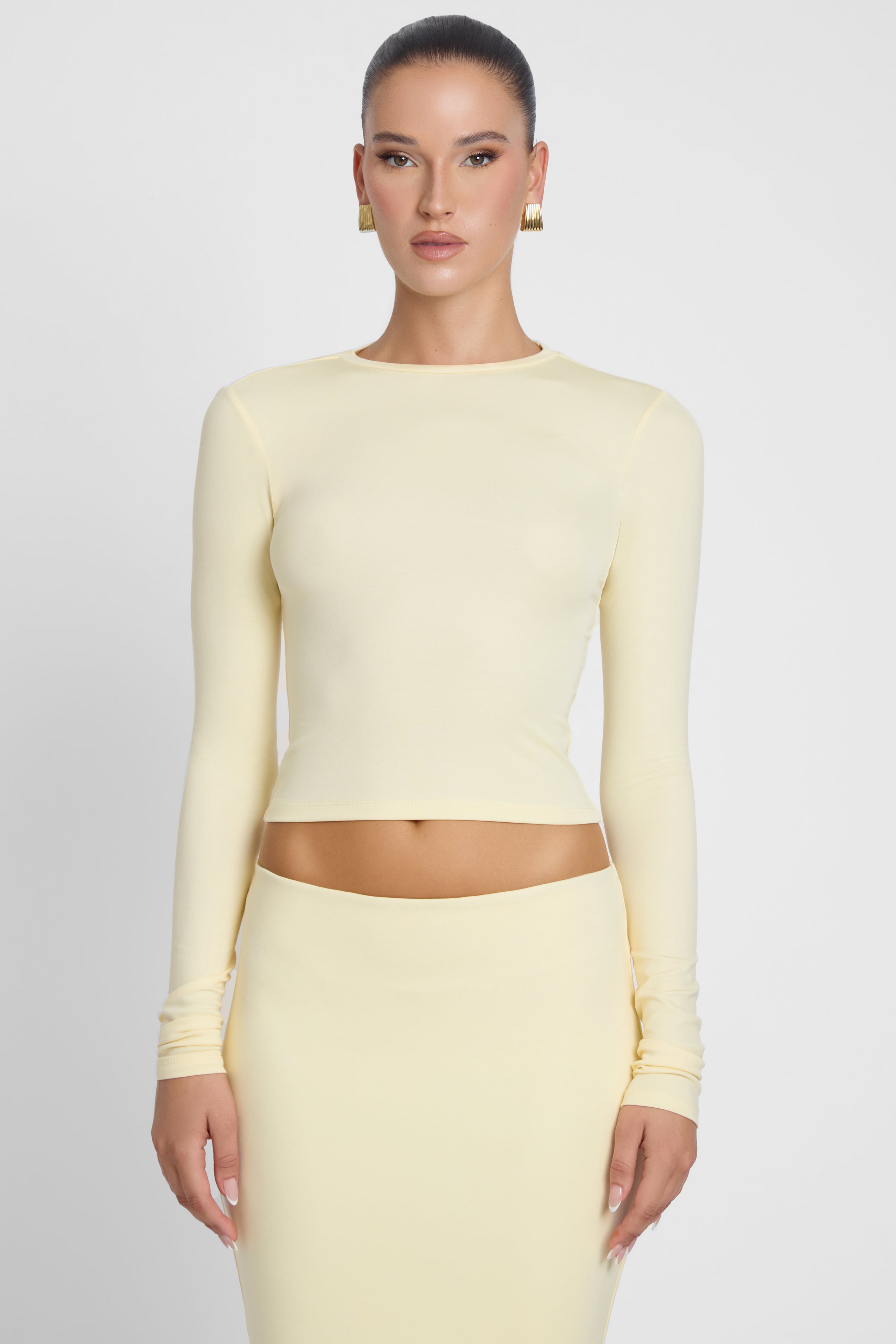 Model is wearing Everyday Jersey Long Sleeve Top Yellow, front view.