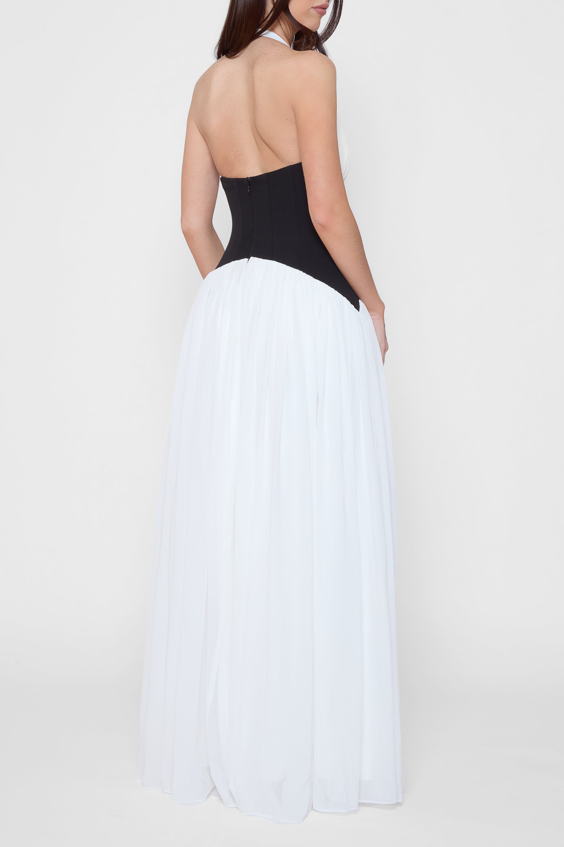 Model wearing Harlowe Contrast Corset Maxi Dress in White, back view.