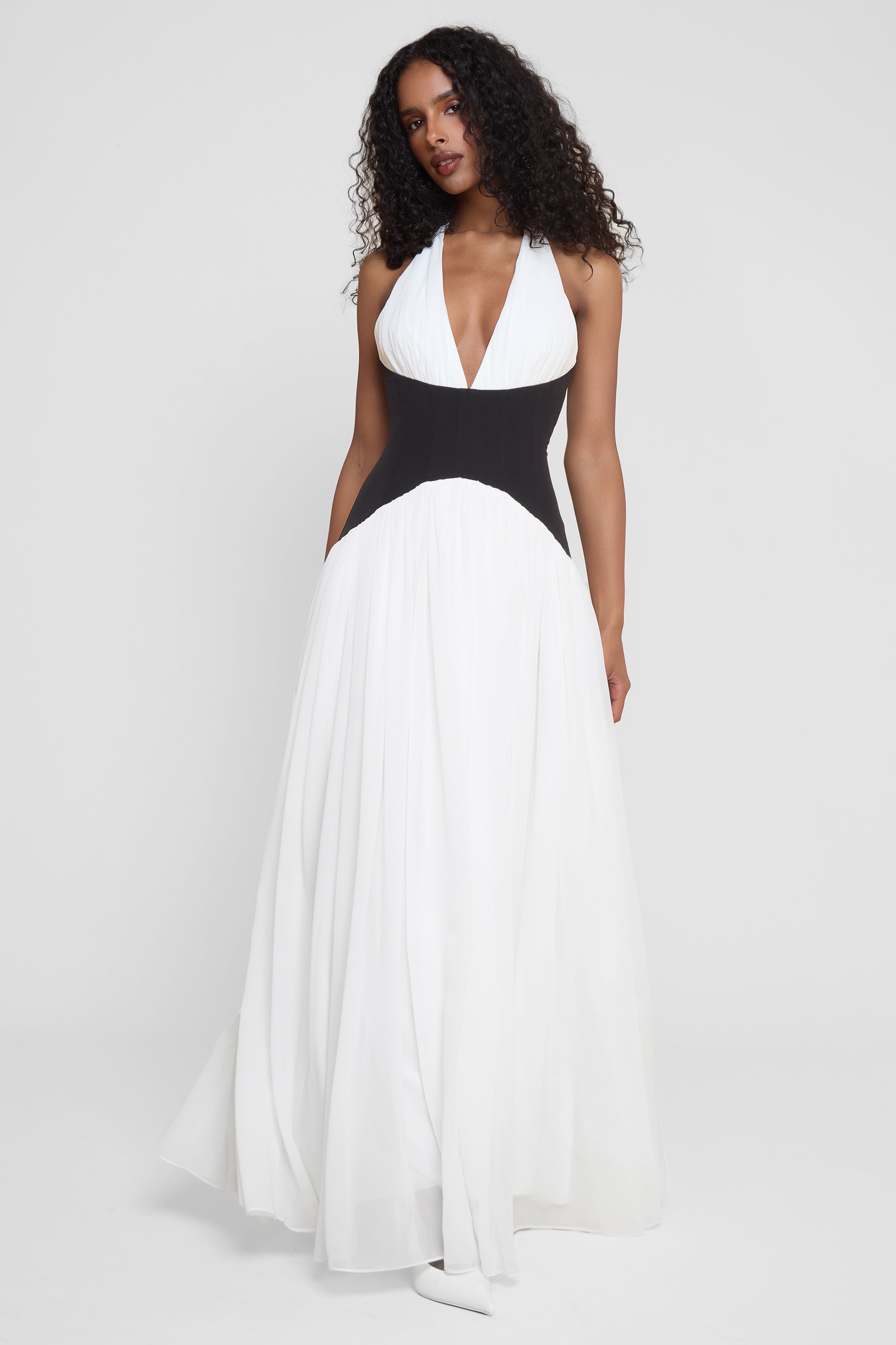 Model wearing Harlowe Contrast Corset Maxi Dress in White, front view.