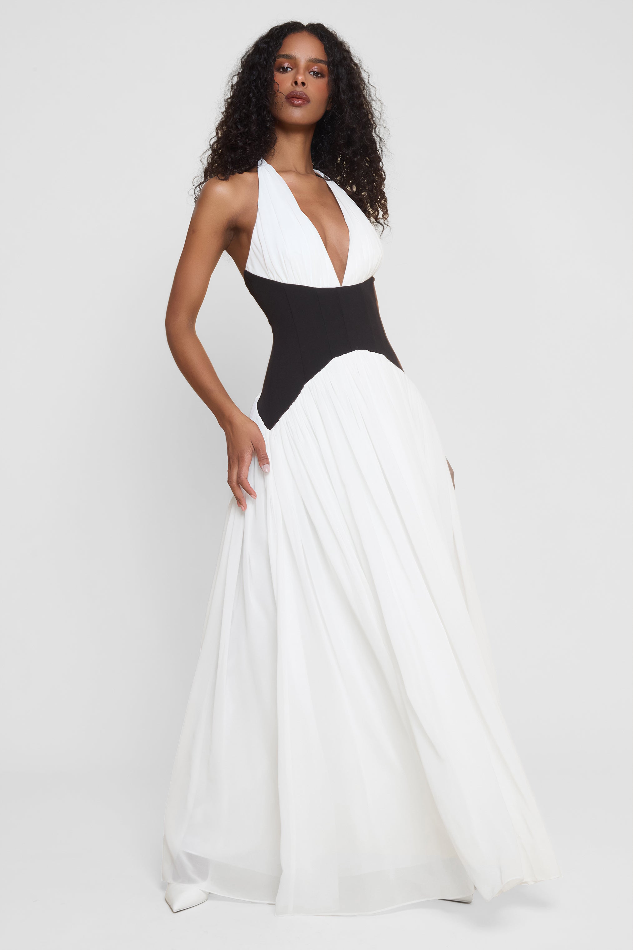 Model wearing Harlowe Contrast Corset Maxi Dress in White, side view.