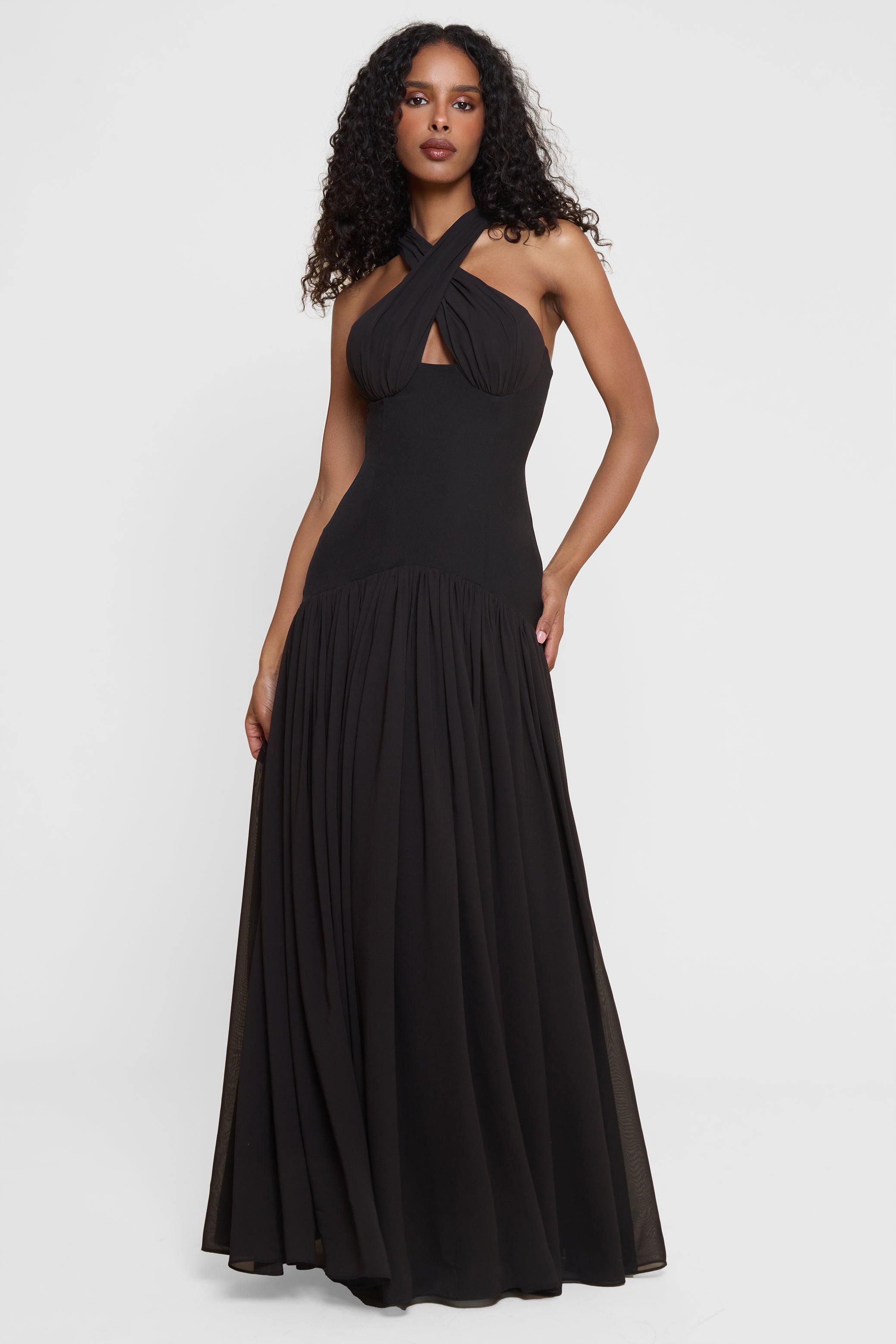 Model wearing Harmony Halter Corset Maxi Dress in Black, front view.