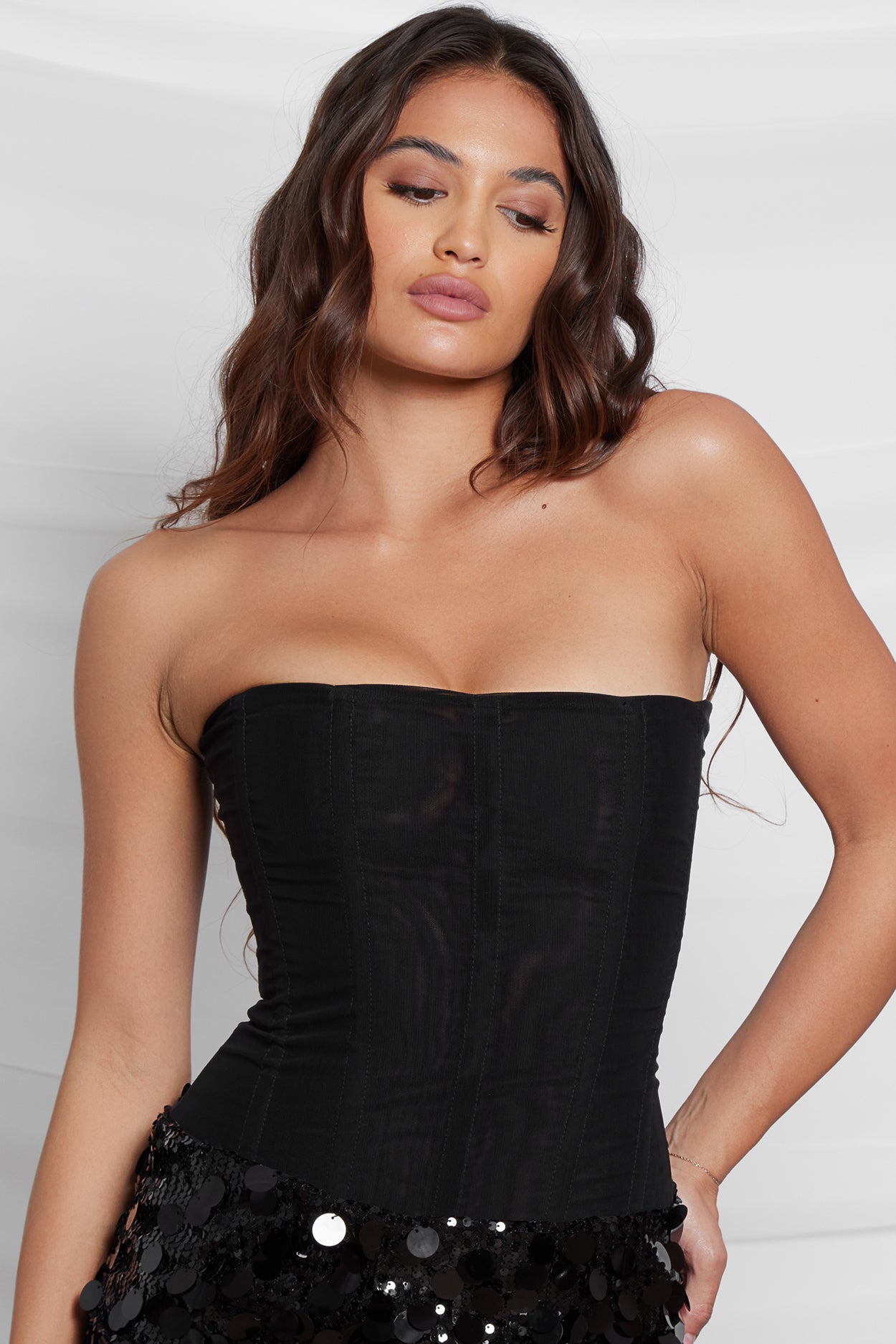 Model wearing Muse Corset in Black, front view.