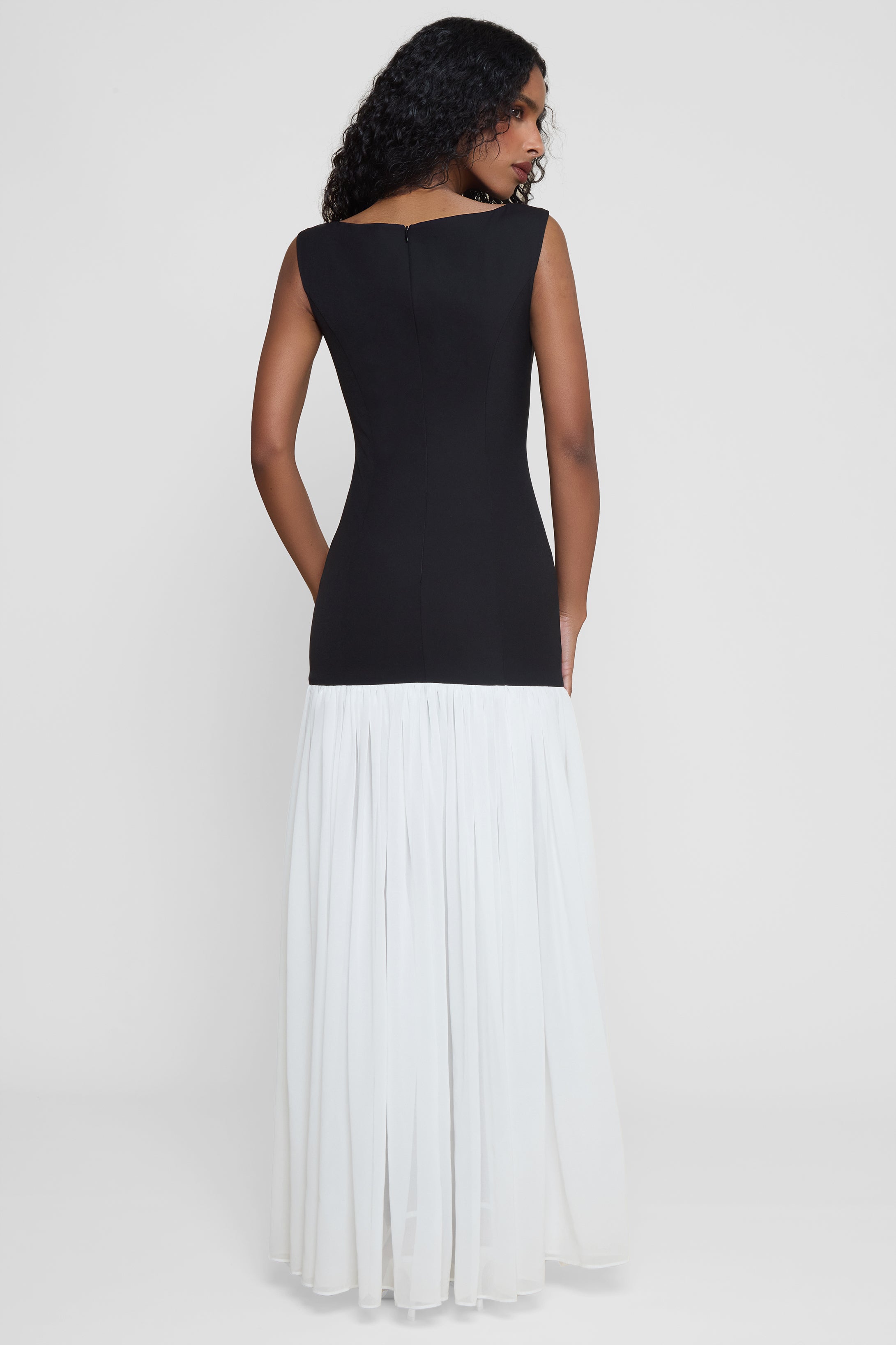 Model wearing Phantom Contrast Chiffon Maxi Dress in Black/White, back view.