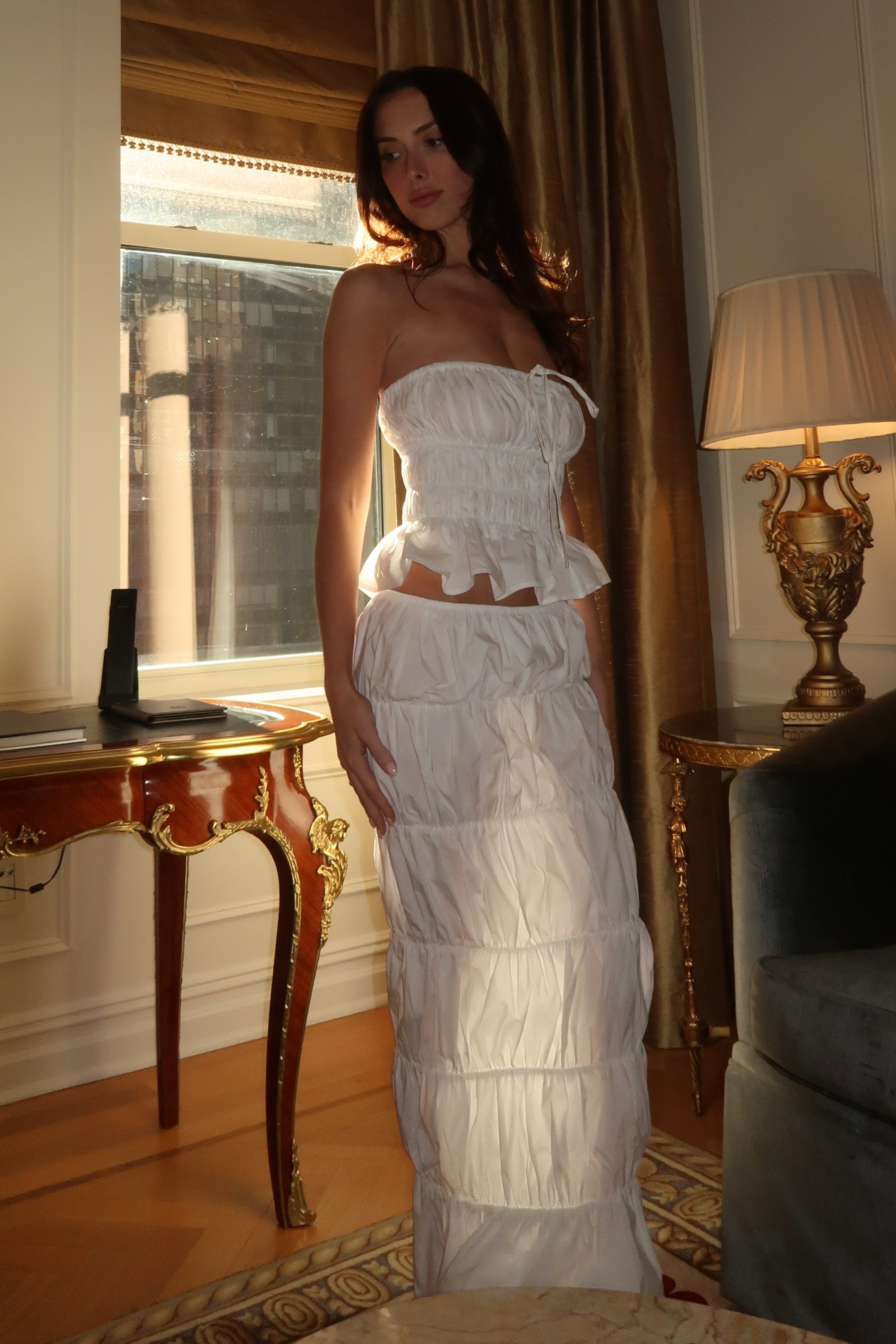 Model wearing Reverie Ruffle Two Piece Set in White, side view.