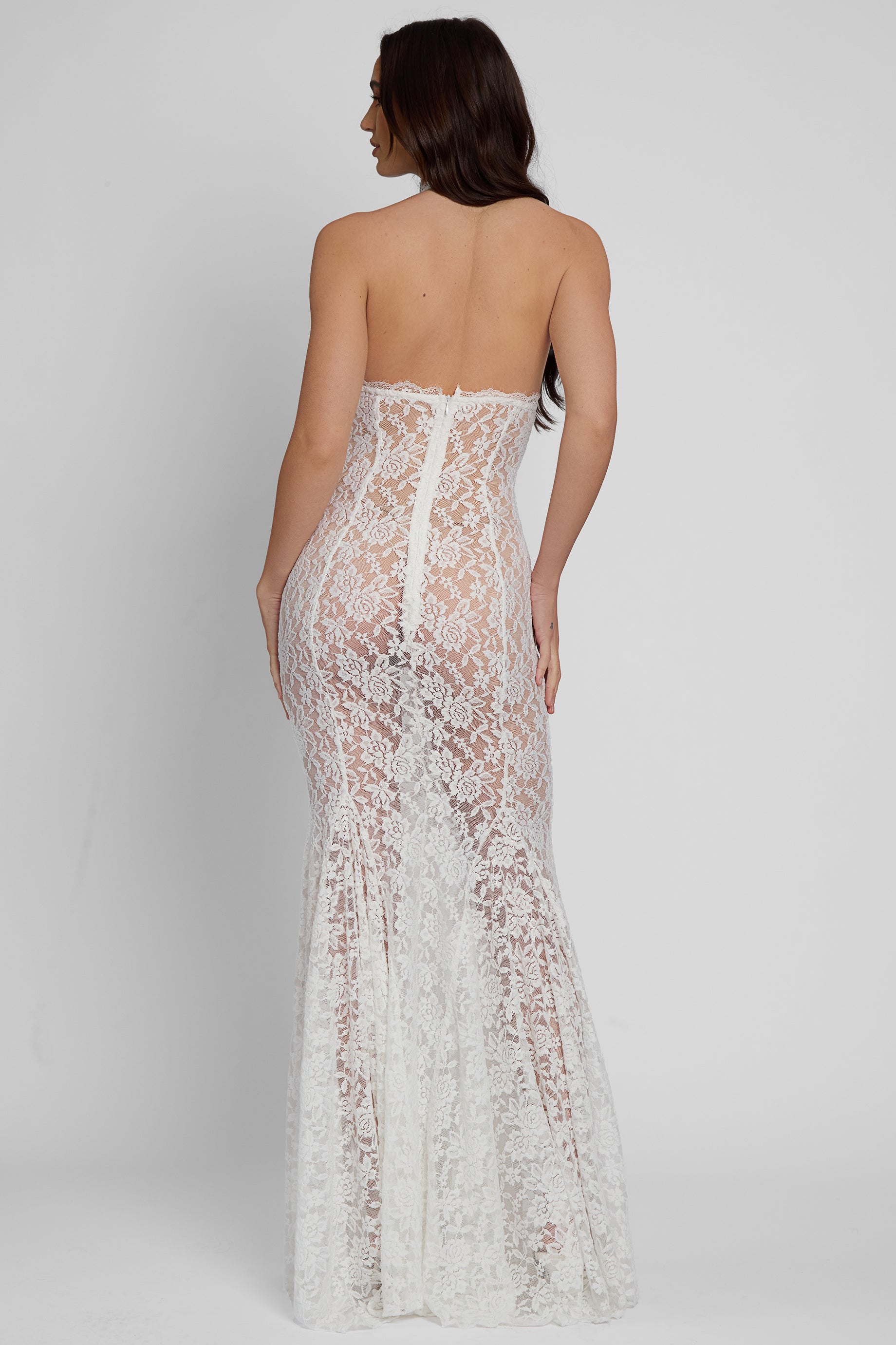 Model wearing Saltair Lace Bustier Maxi Dress in White, back view.
