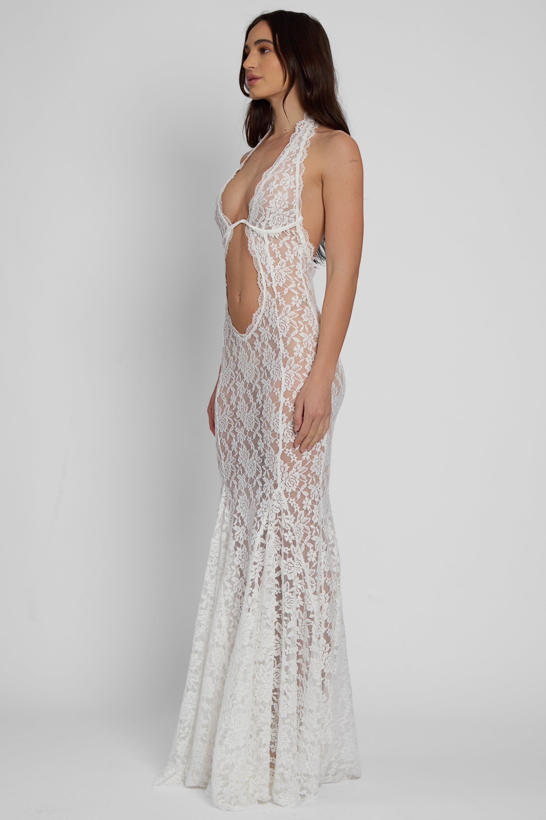 Model wearing Saltair Lace Bustier Maxi Dress in White, side view.