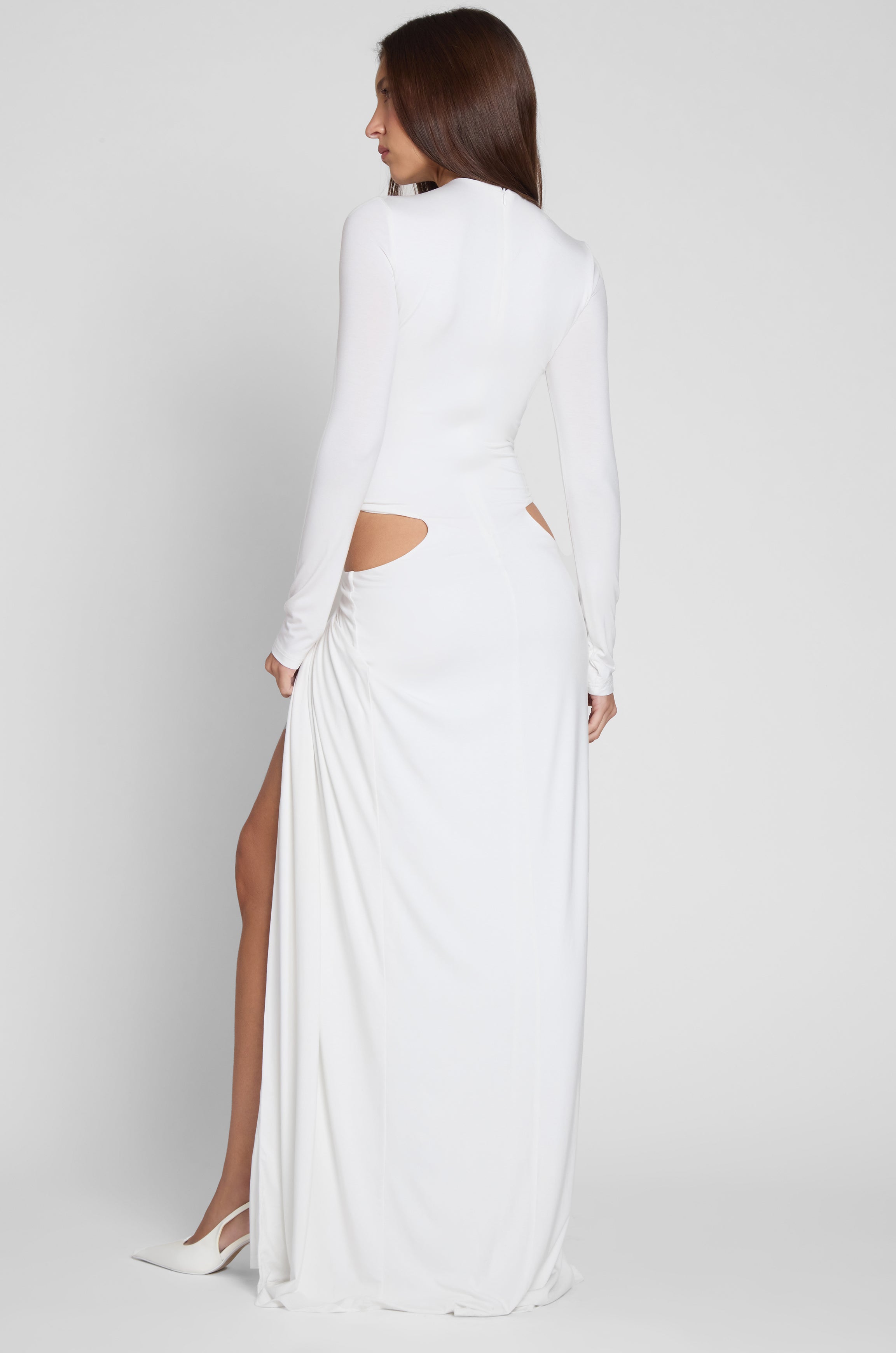 Model wearing Vacanza Drape Gown in White, back view.